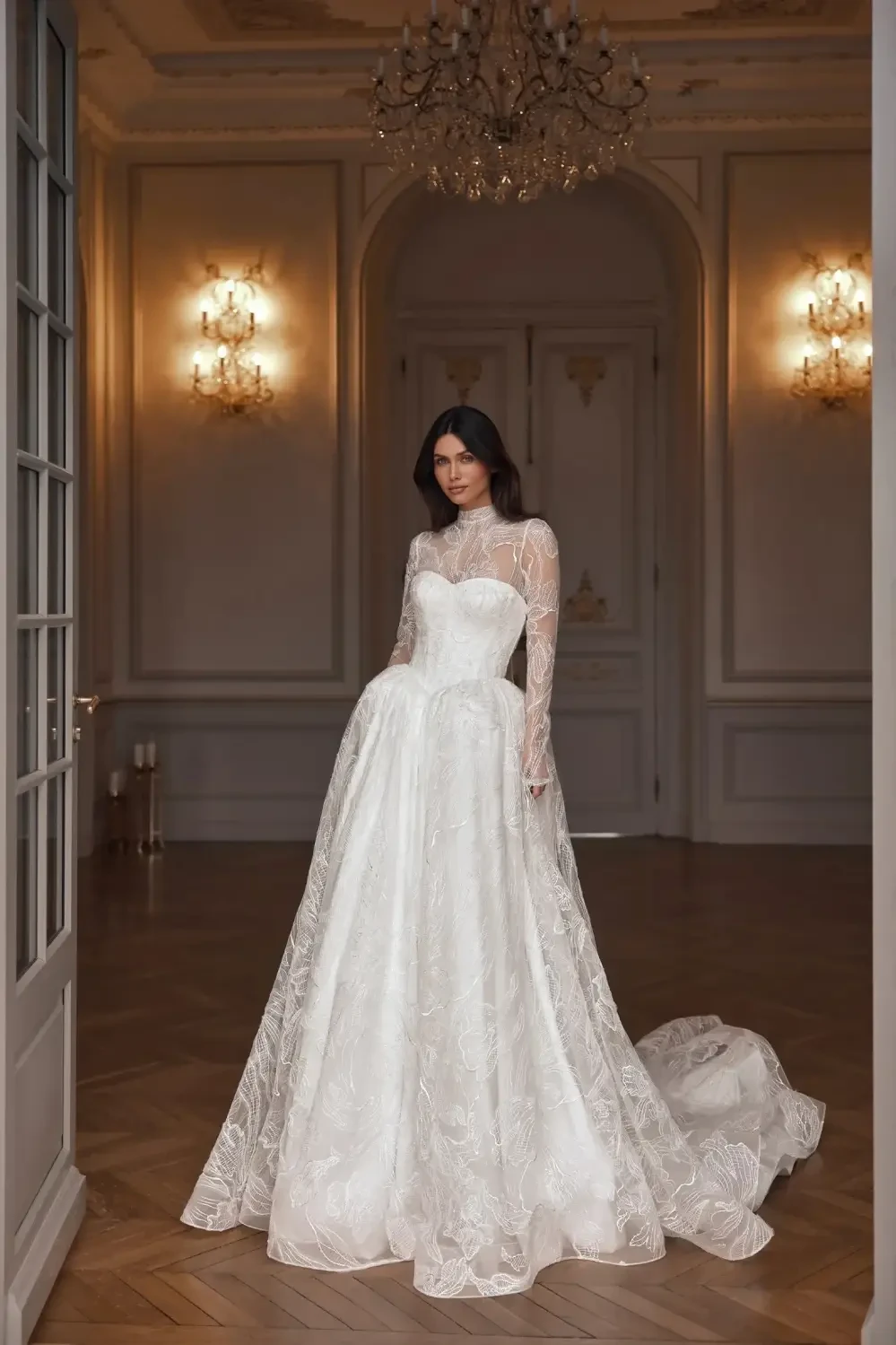 model is wearing a high neck open back bridal gown
