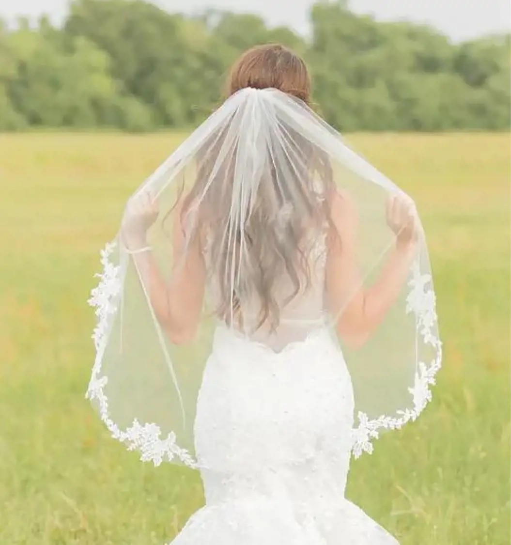 Model wearing a bridal gown. Mobile image